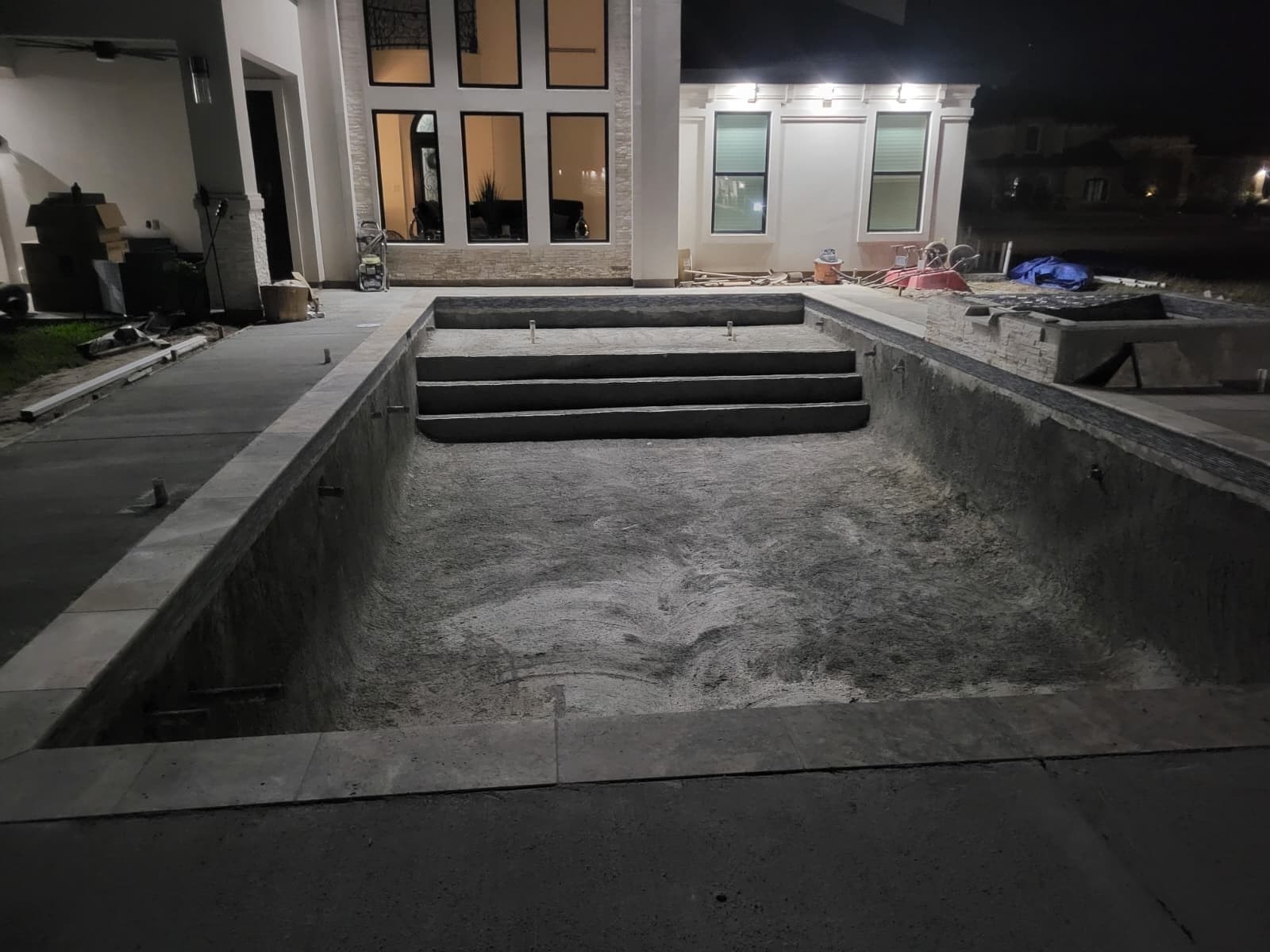 Garma Pools crew applying the plaster finish to a pool shell