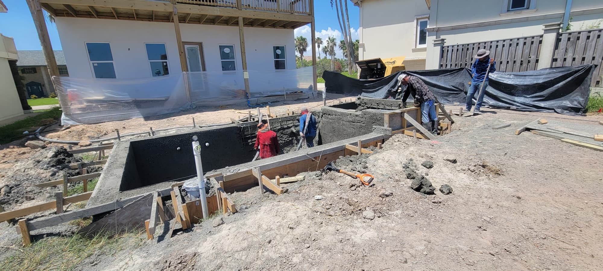 Freshly plastered pool shell with steps, ready for water