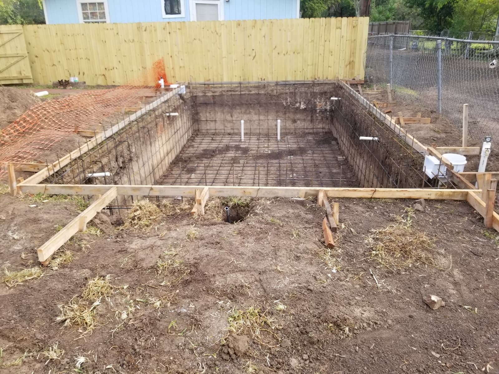 Rebar structure and plumbing installed before the concrete pour