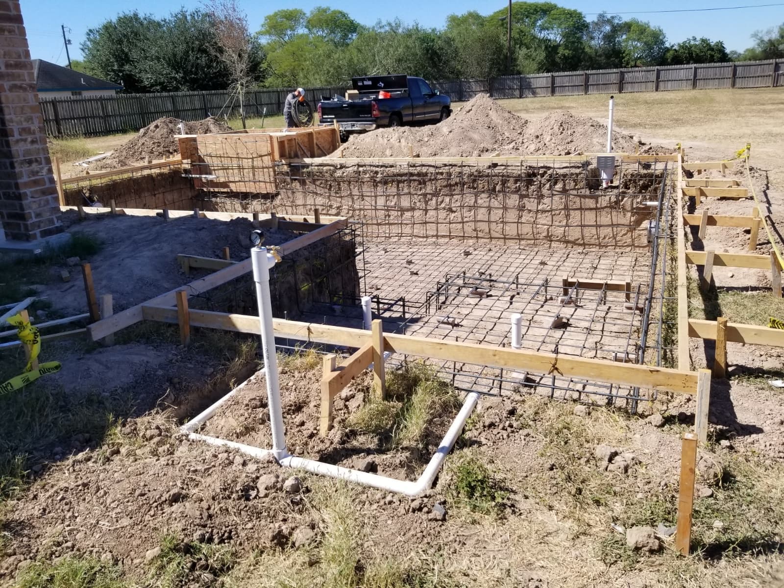 Rebar structure and plumbing installed before the concrete pour